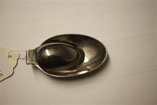 A 20th century Cartier sterling silver travelling double measure folding spoon, 5.25in (open).